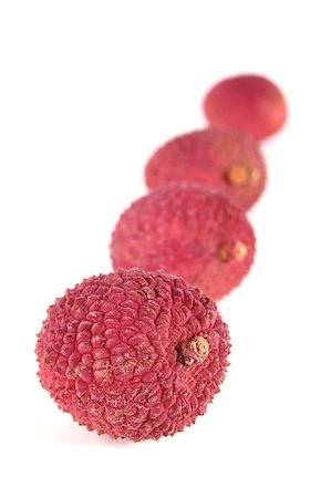 fresh red lychees on a white background Photographie de stock - Aubaine LD & Abonnement, Code: 400-04898343