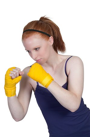 simsearch:400-04423524,k - A beautiful young woman wearing a pair of boxing gloves Stock Photo - Budget Royalty-Free & Subscription, Code: 400-04898533