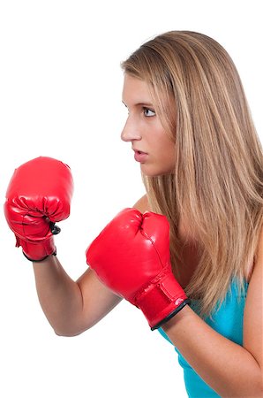 A beautiful young woman wearing a pair of boxing gloves Stock Photo - Budget Royalty-Free & Subscription, Code: 400-04898542