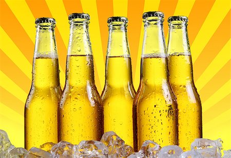 Bottles of beer in ice with abstract orange background Stock Photo - Budget Royalty-Free & Subscription, Code: 400-04898585