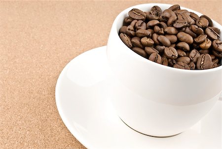 simsearch:400-04604628,k - Close coffee cup filled with coffee beans Stockbilder - Microstock & Abonnement, Bildnummer: 400-04898734