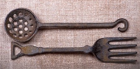 spoon antique - Ancient metal tableware lie on a canvas Stock Photo - Budget Royalty-Free & Subscription, Code: 400-04898780