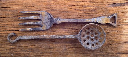 spoon antique - Ancient metal tableware on a wooden blackboard Stock Photo - Budget Royalty-Free & Subscription, Code: 400-04898782