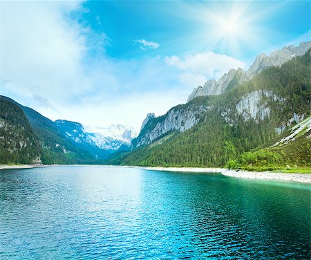 Beautiful summer Alpine  lake Gosausee view and sunshine in sky (Austria) Photographie de stock - Aubaine LD & Abonnement, Code: 400-04898813