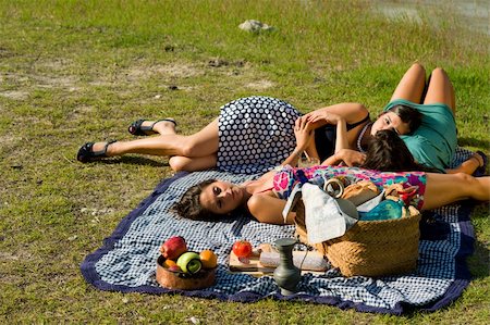 sleep close with girl friend pictures - Girls resting after an ejoyable picnic outdoors Stock Photo - Budget Royalty-Free & Subscription, Code: 400-04898825