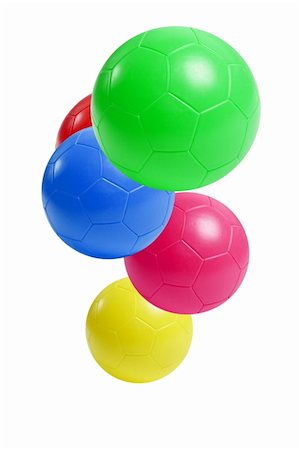 simsearch:400-06392816,k - Colorful plastic soccer balls suspended in the air on white background Foto de stock - Royalty-Free Super Valor e Assinatura, Número: 400-04899301