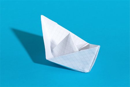 simsearch:400-04177336,k - Paper ship, photo on the blue background Stock Photo - Budget Royalty-Free & Subscription, Code: 400-04899558