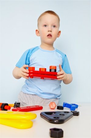 simsearch:400-05292821,k - A child plays with plastic toy parts Stock Photo - Budget Royalty-Free & Subscription, Code: 400-04899606