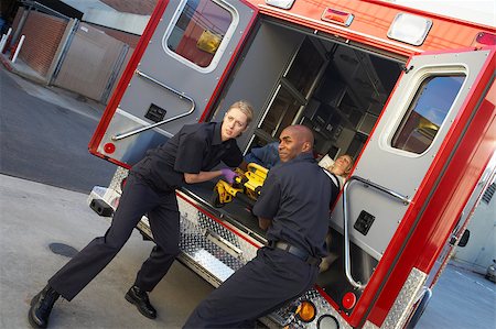Paramedics preparing to unload patient from ambulance Stock Photo - Budget Royalty-Free & Subscription, Code: 400-04890174