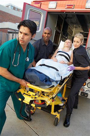 Paramedics and doctor unloading patient from ambulance Stock Photo - Budget Royalty-Free & Subscription, Code: 400-04890179