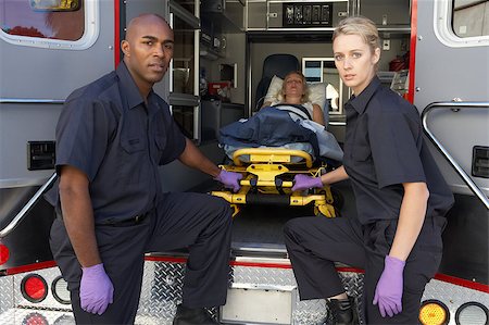 Paramedics preparing to unload patient from ambulance Stock Photo - Budget Royalty-Free & Subscription, Code: 400-04890173