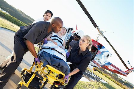 Paramedics unloading patient from Medevac Stock Photo - Budget Royalty-Free & Subscription, Code: 400-04890185