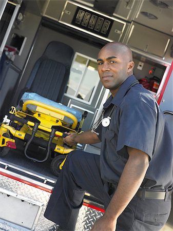 simsearch:400-04890175,k - Paramedic removing empty gurney from ambulance Stock Photo - Budget Royalty-Free & Subscription, Code: 400-04890220