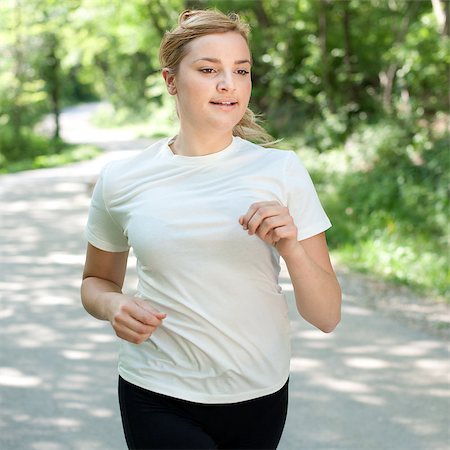 simsearch:400-06768313,k - Attractive young woman on a run in nature Photographie de stock - Aubaine LD & Abonnement, Code: 400-04890808
