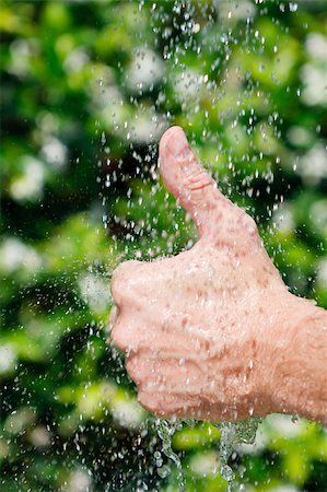 pouring rain on people - Hands under falling water Stock Photo - Budget Royalty-Free & Subscription, Code: 400-04891934