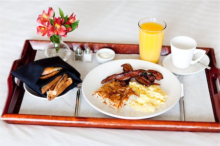 potatoes eggs bacon - delicious breakfast served on the tray on the hotel room bed Stock Photo - Budget Royalty-Free & Subscription, Code: 400-04891999