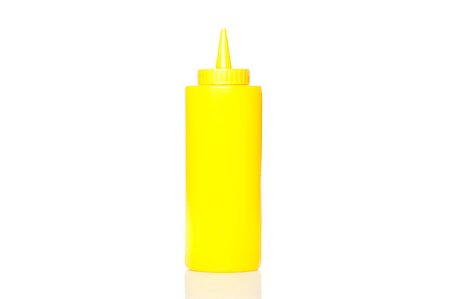 simsearch:400-06919406,k - A yellow mustard bottle against a white background Foto de stock - Royalty-Free Super Valor e Assinatura, Número: 400-04892164