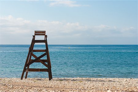 Wooden lifeguard seat facing the ocean, copy space available Stock Photo - Budget Royalty-Free & Subscription, Code: 400-04892310