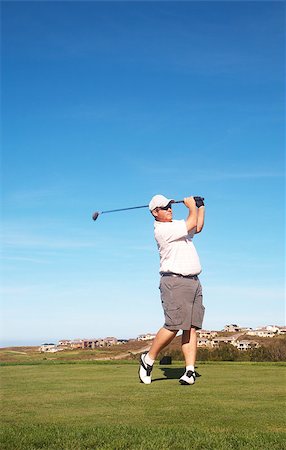 simsearch:400-05038623,k - Young male golfer playing off the tee box on a summer day Stock Photo - Budget Royalty-Free & Subscription, Code: 400-04892434