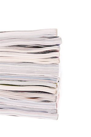 simsearch:400-05901369,k - Closeup of a pile of magazines on white background Stock Photo - Budget Royalty-Free & Subscription, Code: 400-04892654