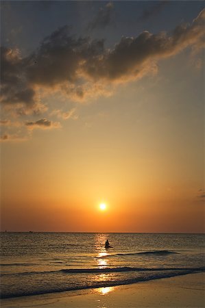 A lone paddler on Siesta Key Beach in Florida during a colorful sunset. Stock Photo - Budget Royalty-Free & Subscription, Code: 400-04893395