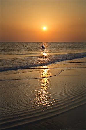 A lone paddler on Siesta Key Beach in Florida during a colorful sunset. Stock Photo - Budget Royalty-Free & Subscription, Code: 400-04893393