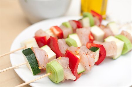 raw chicken dishes - Preparation of shish kebab - Skewer With Chicken Meat, Pepper, Zucchini and Leek Stock Photo - Budget Royalty-Free & Subscription, Code: 400-04893571