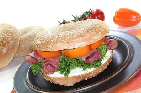sesame bagel - Bagel with salami, peppers, cream cheese and lettuce on white background Stock Photo - Budget Royalty-Free & Subscription, Code: 400-04893817