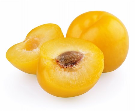 simsearch:400-08530181,k - Yellow plum with halves isolated on white background Stock Photo - Budget Royalty-Free & Subscription, Code: 400-04904109