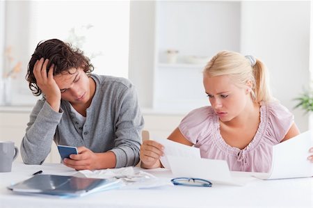 Couple in despair while doing accounts in the living room Stock Photo - Budget Royalty-Free & Subscription, Code: 400-04904582