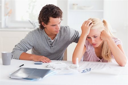 Man comforting his wife in their living room Stock Photo - Budget Royalty-Free & Subscription, Code: 400-04904682