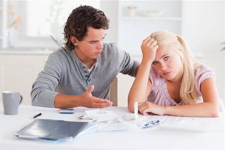 Despaired couple doing their accounts in the living room Stock Photo - Budget Royalty-Free & Subscription, Code: 400-04904714