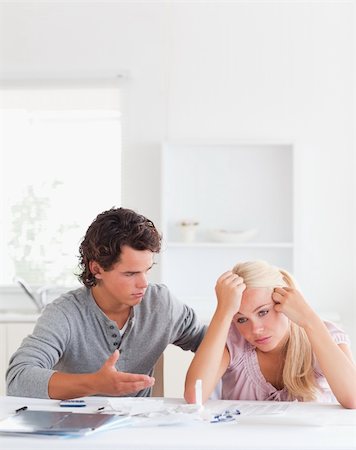 Man trying to comfort his wife in their living room Stock Photo - Budget Royalty-Free & Subscription, Code: 400-04904722