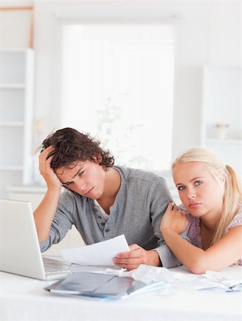 Worn out couple in their living room Stock Photo - Budget Royalty-Free & Subscription, Code: 400-04904796