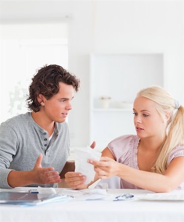 Couple doing their accounts in their living room Stock Photo - Budget Royalty-Free & Subscription, Code: 400-04904860