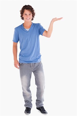 finger pointing up - Handsome guy showing copyspace in a studio Stock Photo - Budget Royalty-Free & Subscription, Code: 400-04904863