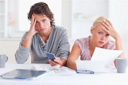 Worn down couple in their living room Stock Photo - Budget Royalty-Free & Subscription, Code: 400-04904871