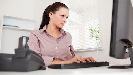 A businesswoman is typing on her keyboard Stock Photo - Budget Royalty-Free & Subscription, Code: 400-04905231