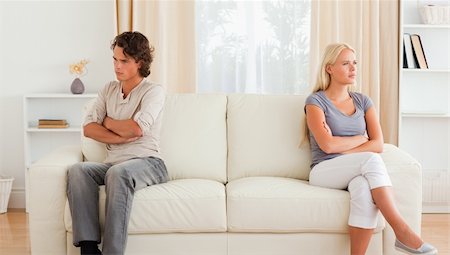 simsearch:400-04202085,k - Couple angry at each other sitting on a sofa Foto de stock - Royalty-Free Super Valor e Assinatura, Número: 400-04905464