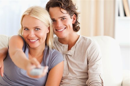elegant tv room - Lovey couple watching TV in their living room Stock Photo - Budget Royalty-Free & Subscription, Code: 400-04905577