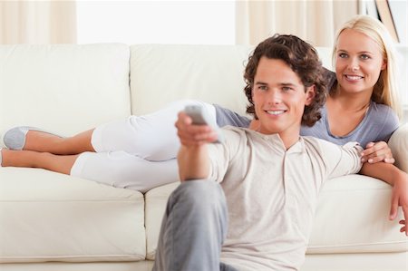 elegant tv room - Cute couple watching the television in their living room Stock Photo - Budget Royalty-Free & Subscription, Code: 400-04905708