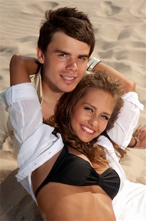 simsearch:400-06360128,k - couple in love young people lie on the beach Stock Photo - Budget Royalty-Free & Subscription, Code: 400-04906317