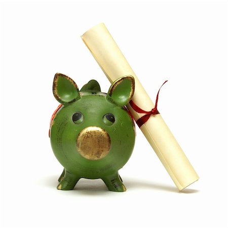 An isolated shot of a piggy bank and diploma scroll for saving for an education. Stock Photo - Budget Royalty-Free & Subscription, Code: 400-04908013