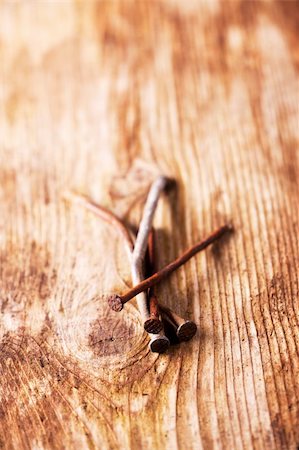 rusty tools - closeup of rusty nails on a wooden plank Stock Photo - Budget Royalty-Free & Subscription, Code: 400-04908835