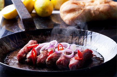 cevapcici minced meat rolls in a pan Foto de stock - Super Valor sin royalties y Suscripción, Código: 400-04908890