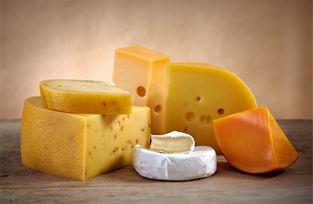 foodphoto (artist) - various types of cheese on old wooden table Fotografie stock - Microstock e Abbonamento, Codice: 400-04909277