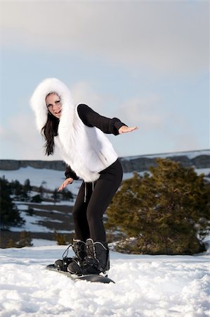 extreme cold clothes women - girl with a snowboard on the mountain is Stock Photo - Budget Royalty-Free & Subscription, Code: 400-04909525