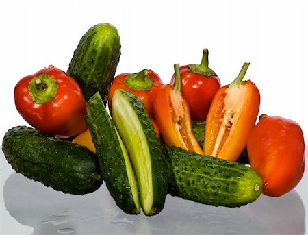 cucumbers and peppers on a white background Photographie de stock - Aubaine LD & Abonnement, Code: 400-04909650