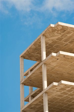 solids architecture unfinished - Unfinished concrete structure of a high rise builiding Stock Photo - Budget Royalty-Free & Subscription, Code: 400-04900115