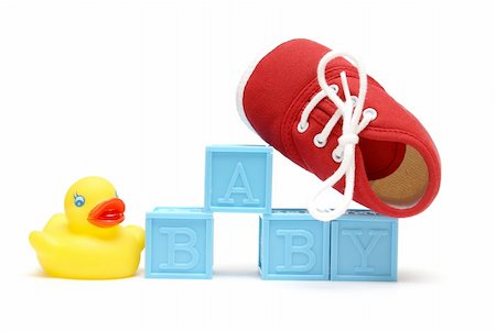 The word baby is isolated on white with a rubber ducky and a red shoe. Stock Photo - Budget Royalty-Free & Subscription, Code: 400-04900202